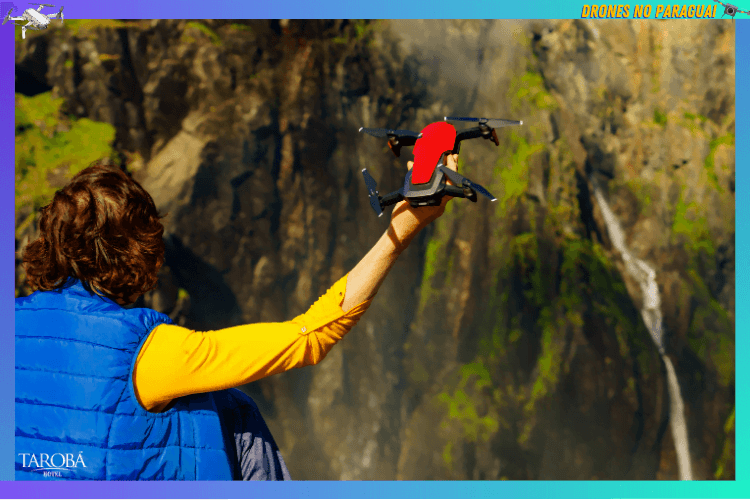 Moça jogando o drone no penhasco