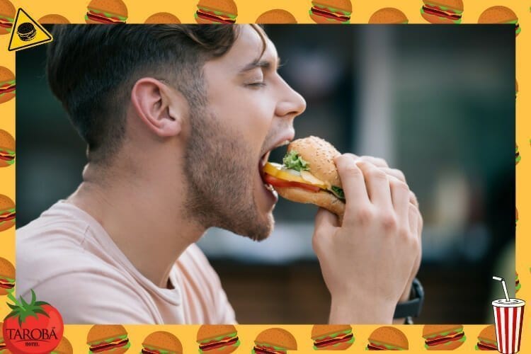Onde tem Hamburgueria em Foz do Iguaçu? - Homem comendo hambúrguer